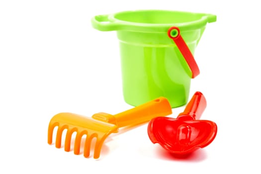 Children's toys  bucket  shovel and  rake on the white