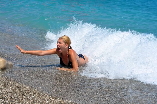 young woman drown in the mediterranean sea blue water