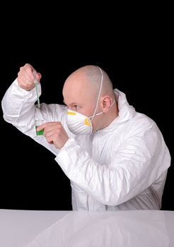 scientist working on formula isolated on black dropplet from pipette in mid air
