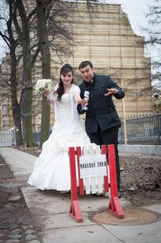 Bride and groom standing at the door