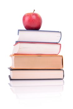 a red apple in books isolated on white