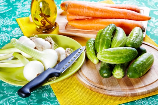 Still-life with onions cucumbers garlic and carrots