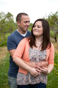 Young happy couple enjoying each others company outdoors.