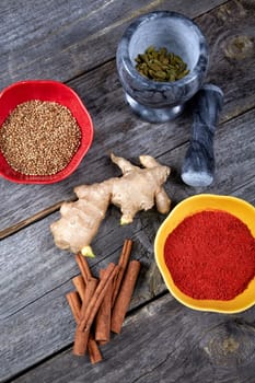 Still-life with ginger and cinnamon on an old kitchen table