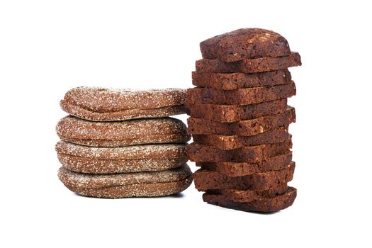 Two piles of slices  black bread isolated on a white background