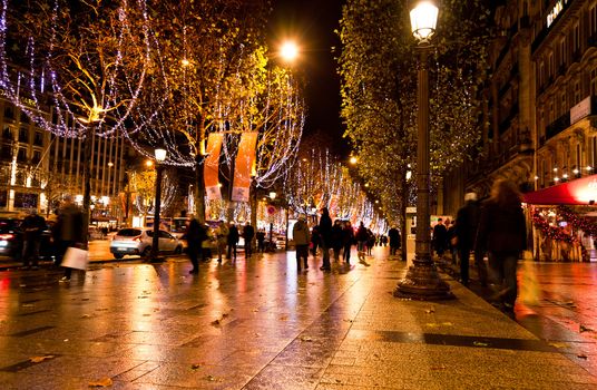 the famous shooping district Champs Elysees illuminated with Christmas light in Paris 