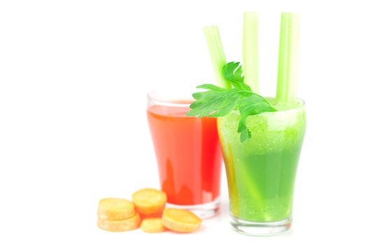 glass of celery juice and a glass of carrot juice isolated on white