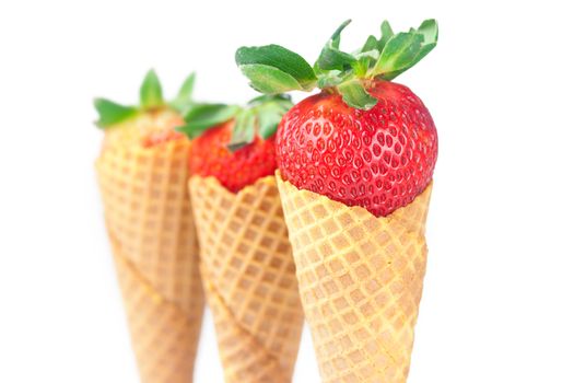 strawberry in a waffle cone isolated on white