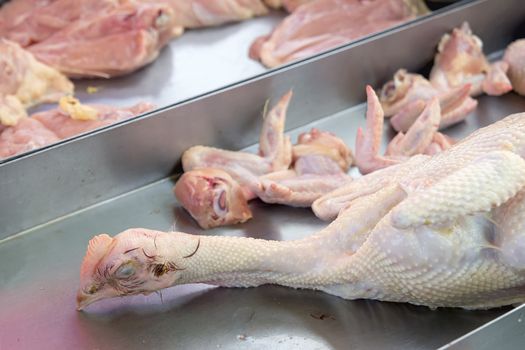 Slaughtered Fresh Whole Chicken with Head Wings Breast Meat at Wet Market in Southeast Asia