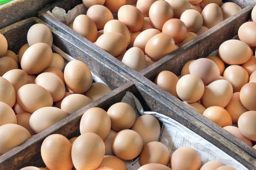 Chicken Egg Vendor with Eggs For Sale in Wooden Crates at Southeast Asia Wet Market