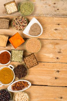 Assorted spices on an old wooden table