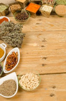 Assorted spices on an old wooden table