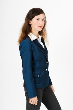 A young girl in a blue suit standing