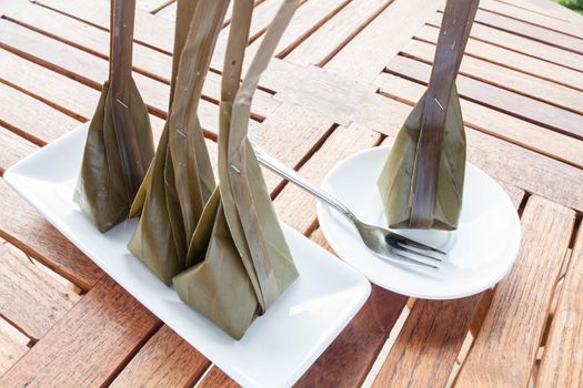 Steamed flour with coconut filling on wooden table, stock photo