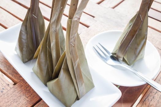 Steamed flour with coconut filling and fork, stock photo