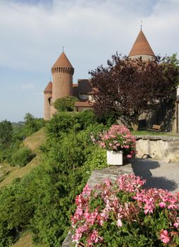 Side view of middle-ages Chenaux castle at Estavayer-le-lac by sunset, Fribourg canton, Switzeralnd