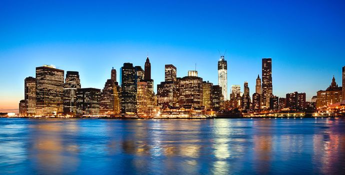 New York City skyline at twilight w the Freedom tower