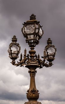 Street Lantern on the Alexandre III Bridge against Cloudy Sky, Paris, France.