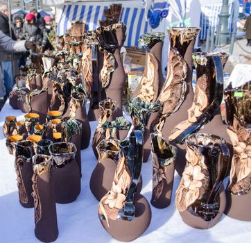 People buy various crockery clay vase in outdoor street marketplace fair