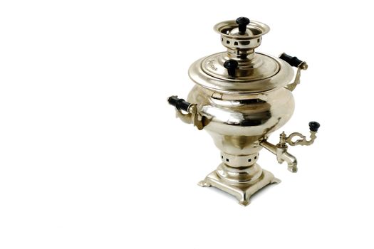 Model of the electric samovar white shiny metal on a white background in the singular.