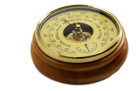 Barometer in the frame of wood . Presented on a white background.