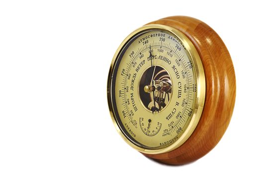 Barometer in the frame of wood . Presented on a white background.