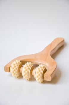 wood tool for massage on white background