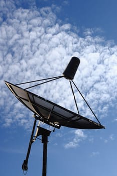 The satellite dish with the blue sky background