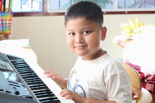 Little Boy playing piano fun