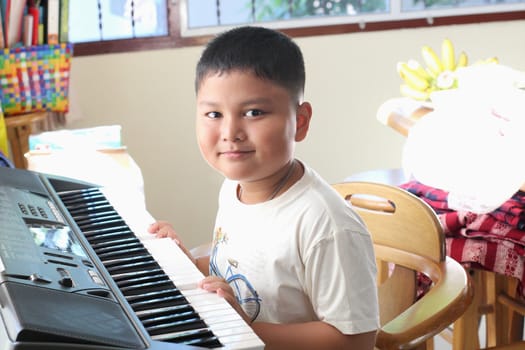 Little Boy playing piano fun