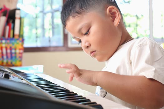 Little Boy playing piano fun