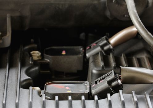 Modern car gasoline engine servicing, ratchet and spark plug
