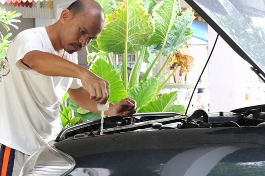 People are repairing cars.