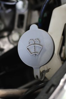 gray liquid caps inside a car engine