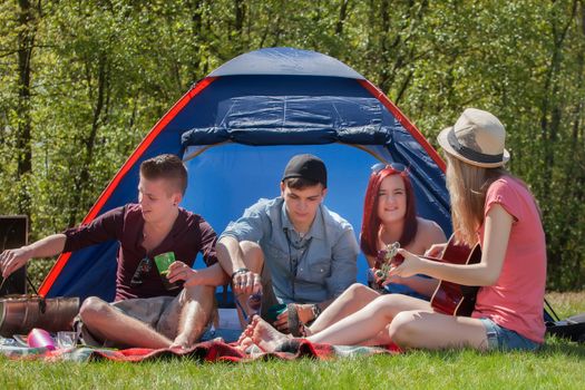 Young teenager group are having their holliday on a camping