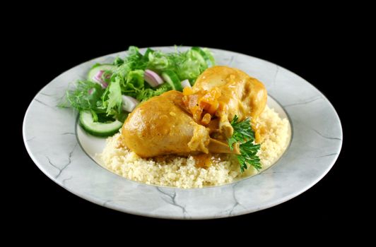 Apricot chicken drumsticks with a green side salad.