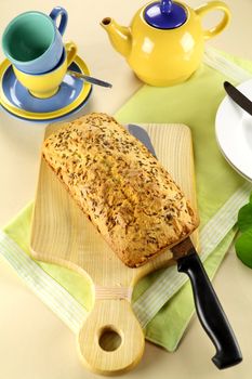 Fresh baked caraway seed loaf with tea ready to serve.