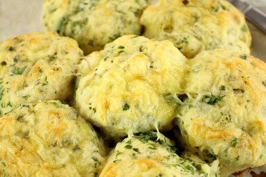 Delicious fresh baked savory cheese and spinach scones ready to serve.