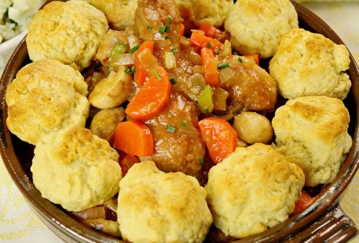 Delicious chicken and dumpling casserole with with a rich gravy.