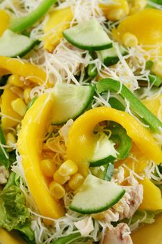 Delicious and colorful chicken, mango and noodle salad.