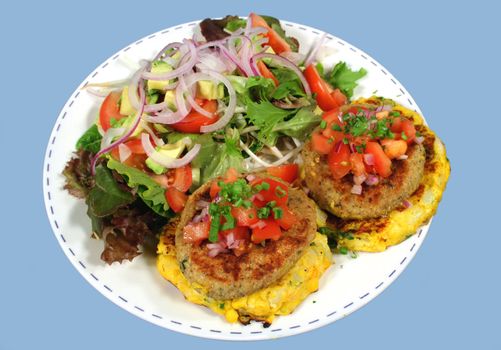 Main of chicken and potato patties with tossed salad.