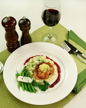 Chicken fillet mignon on parsley mashed potato with green beans and blue cheese and red wine and raspberry jus.