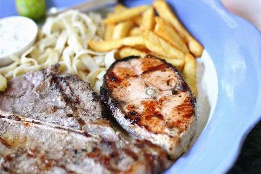 T-Bone steaks and salmon.