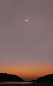 Young Moon at sunset in India - Goa - Palolem beach