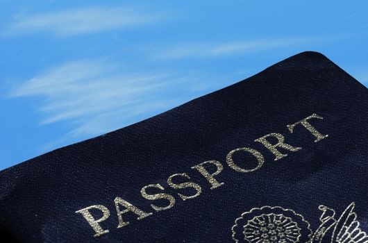 passport on blue sky for international travel concept