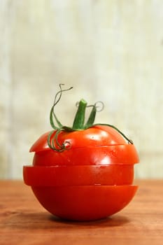 Red Hothouse Tomatoes on a Rustic Wood Plank