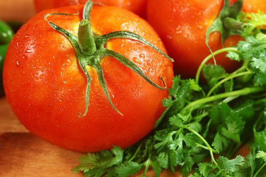 Red Hothouse Tomatoes on a Rustic Wood Plank