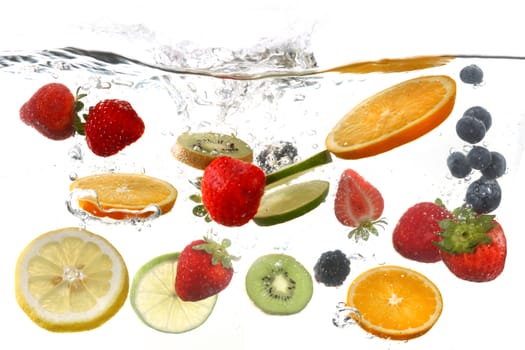 Sliced Fruits Falling Into Splashing Clear Water