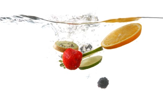 Sliced Fruits Falling Into Splashing Clear Water