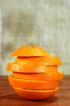 Orange Fruit Sliced Sitting on a Wooden Surface